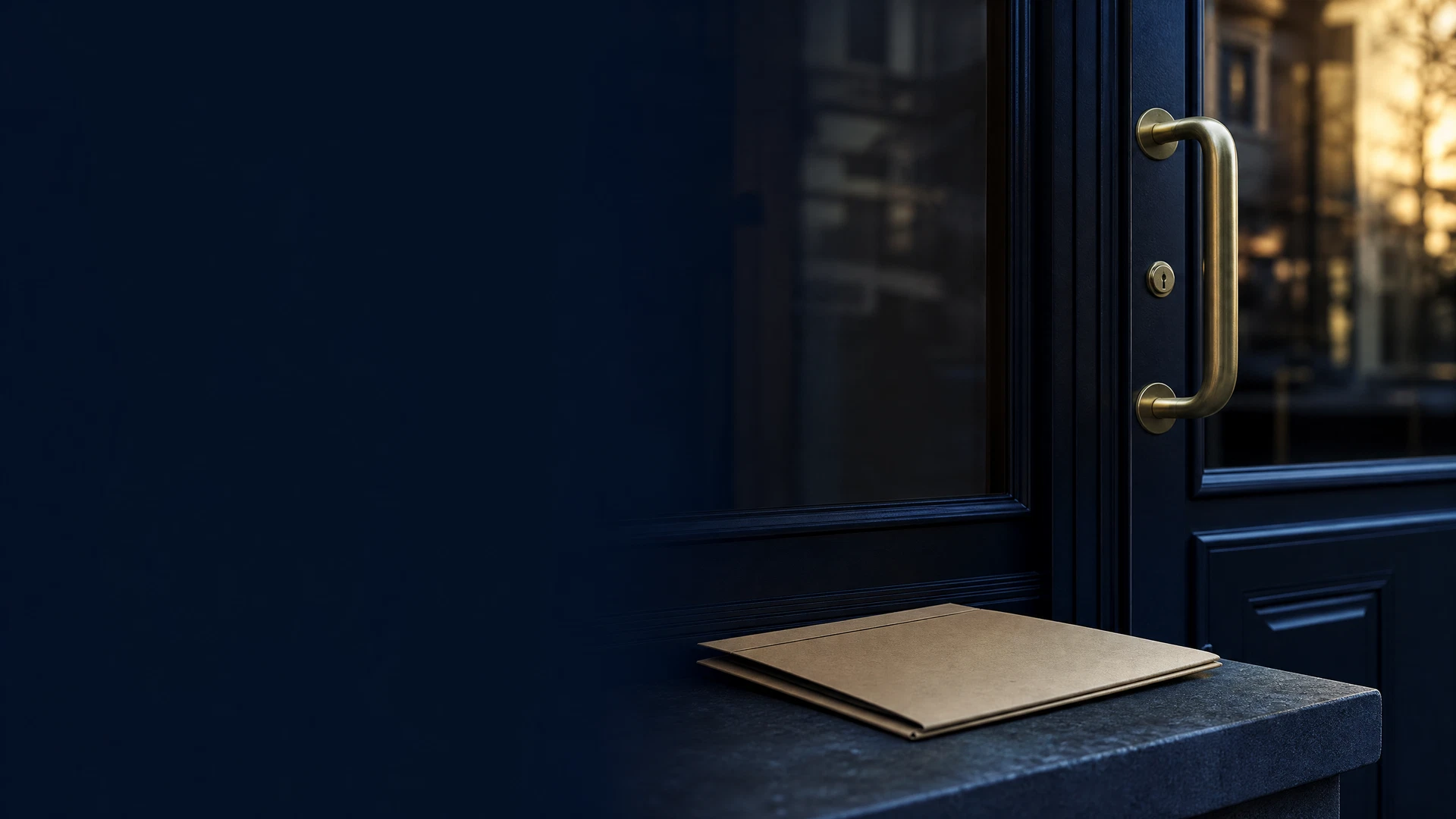 Shadowed commercial doorway and blank property folder